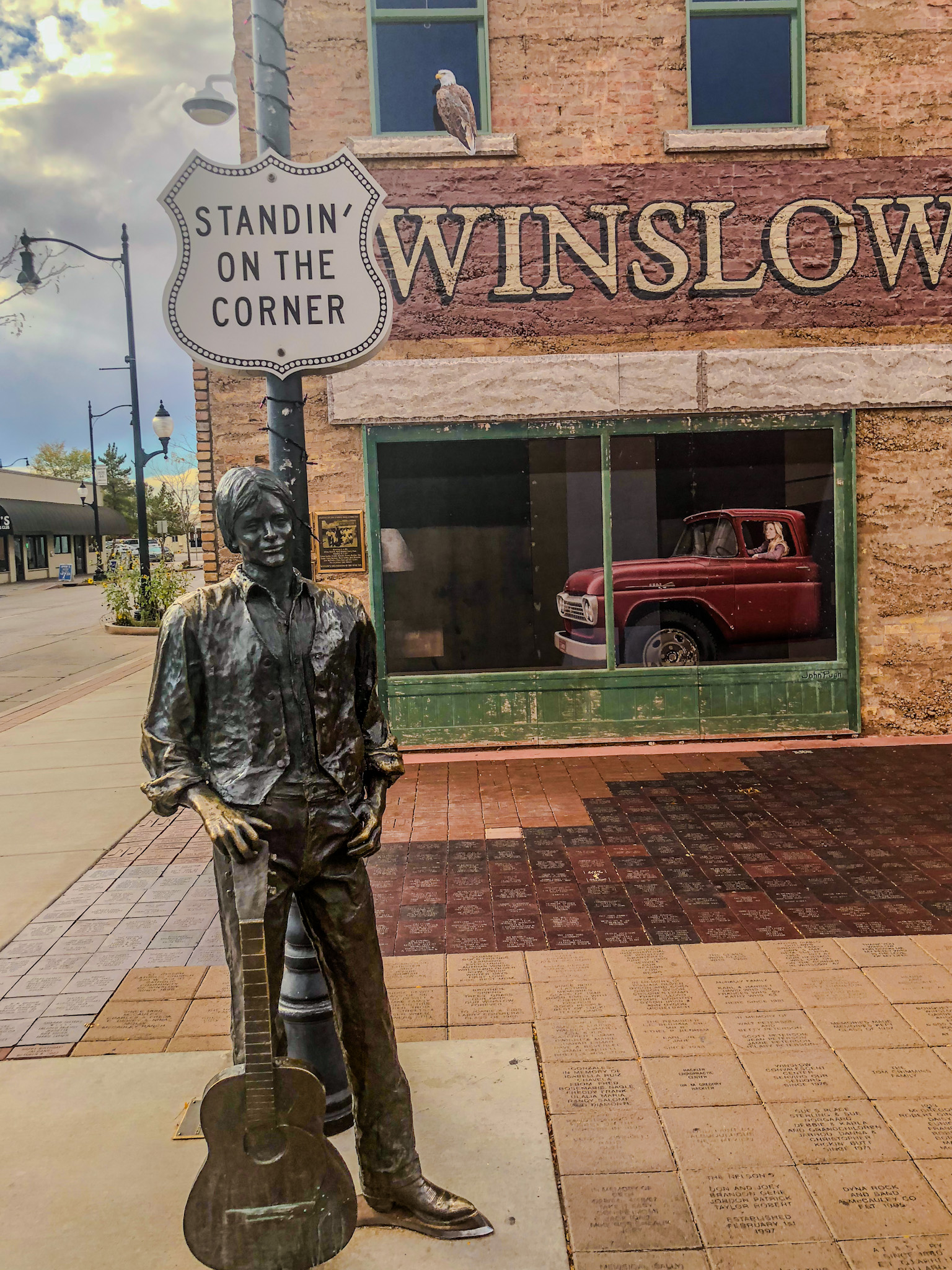 a statue of a man holding a guitar